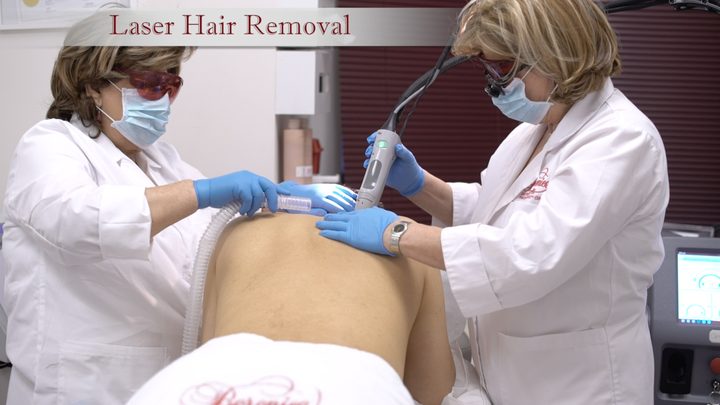 Two practitioners at Berenice performing a laser hair removal treatment